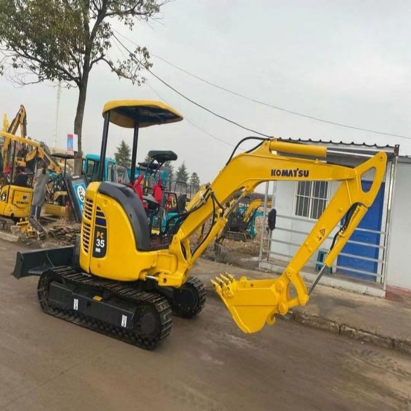Подержанный экскаватор Komatsu PC35 Использованный 3,5 тонный мини-скрепочный экскаватор